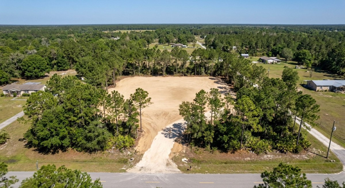 Graded and leveled homesite pad on cleared land near Gainesville FL